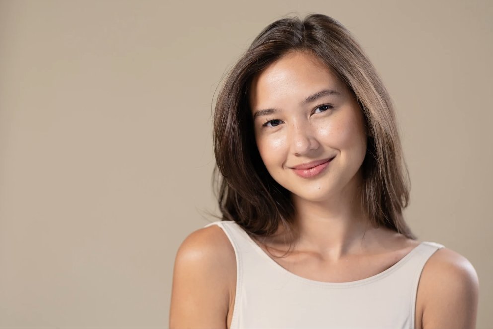 A smiling person with healthy skin